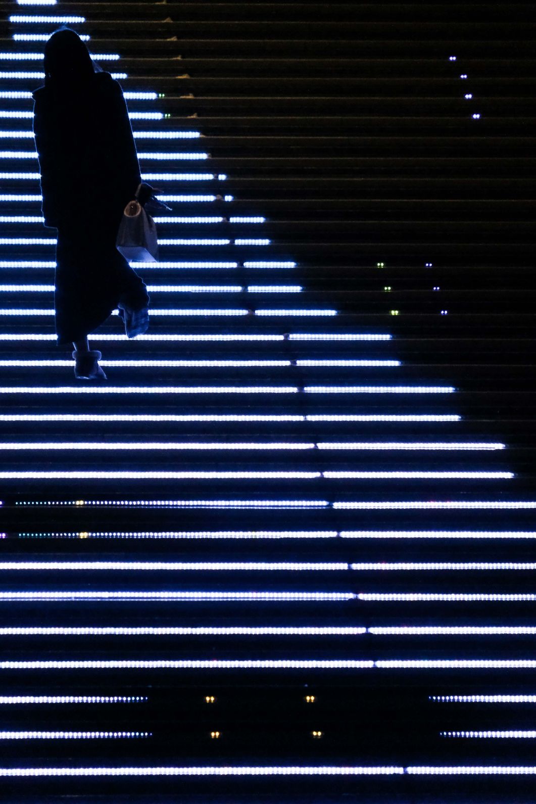 Adjusting your exposure or ‘‘brightness’’ to the most brightest part of the image can result in a very moody image. We exposed for the brightness to the LED lit stairs creating silhouettes.
